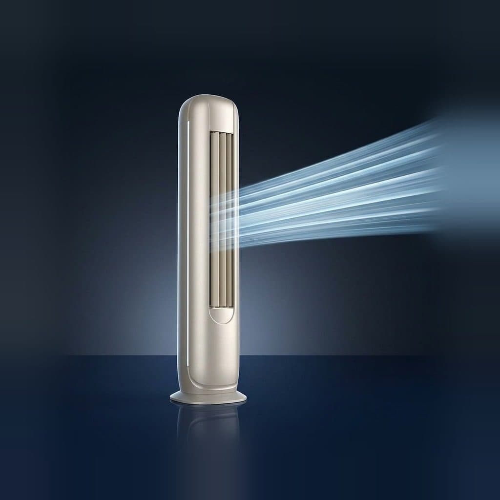A champagne floor-standing air conditioner tower stands on a reflective navy floor and blows one tight bundle of pale-blue airstreams from its front louvre slot to the right, against a dark navy studio wall.
